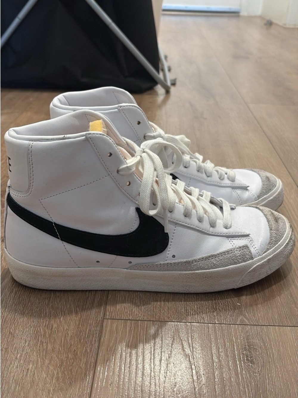 Nike White High-Top Sneakers with Black Swoosh